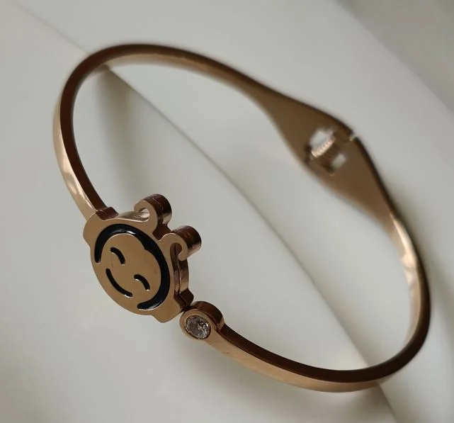 Big Bangles For Bold Fashion-Tarohi Jewels Stainless Steel Rosegold Plated Smiley Face Fancy Kada- STKD 2685